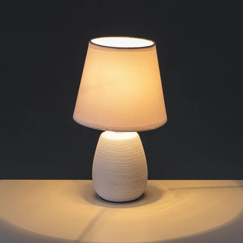 Lámpara de mesa rústica de cerámica blanca con textura rugosa de ø 17x27 cm