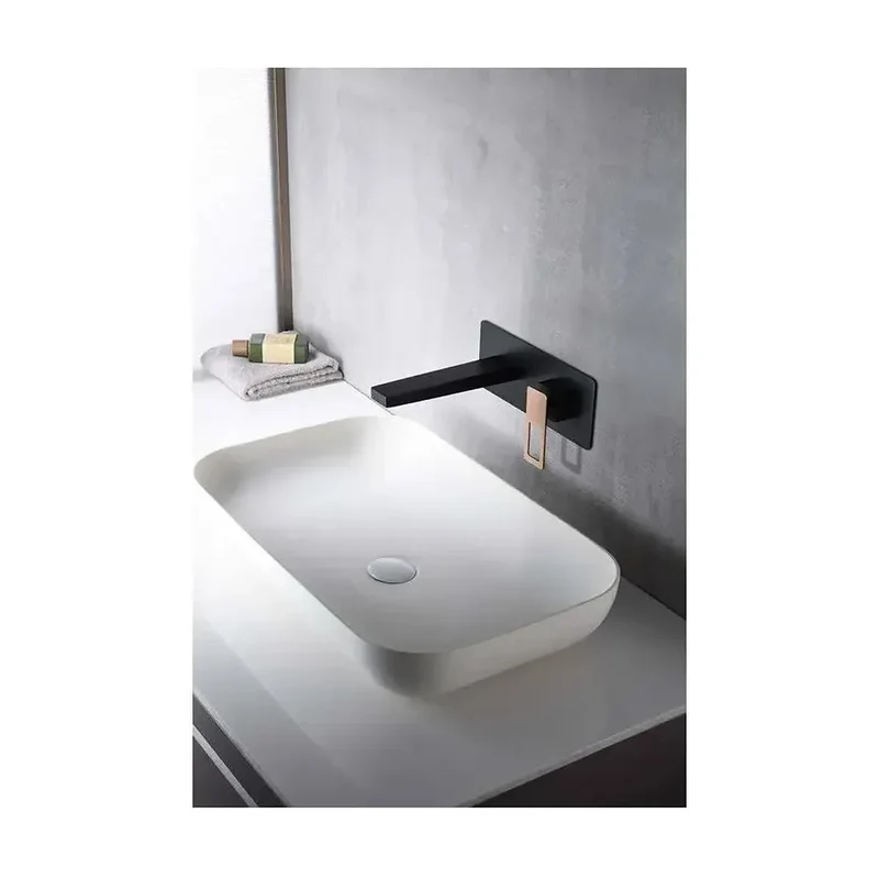 Grifo de lavabo monomando empotrado a pared de acabado negro y oro rosa Suecia de Imex