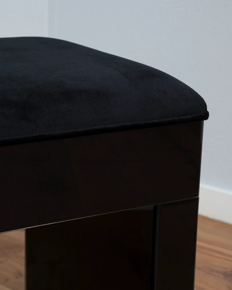 The black vanity stool
